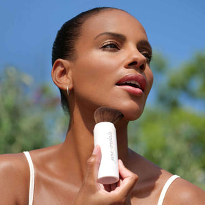 Girl Using Powder-Me SPF® 30 Dry Sunscreen